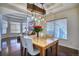 A dining room featuring an eye-catching light fixture, hardwood floors, and a comfortable seating area is perfect for relaxation at 4142 S Deframe Ct, Morrison, CO 80465