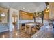 An exquisite kitchen featuring custom wood cabinetry, brick backsplash, and modern appliances, ideal for culinary enthusiasts at 4142 S Deframe Ct, Morrison, CO 80465