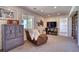 Cozy living room featuring a comfortable recliner, nice cabinet, and a window view at 4142 S Deframe Ct, Morrison, CO 80465