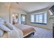Serene main bedroom with a bay window, cozy window seat, and ensuite access at 4142 S Deframe Ct, Morrison, CO 80465