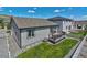 Aerial view showcasing the backyard with deck, lawn, and rock landscaping at 1868 Makley Loop, Castle Rock, CO 80104