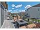 Relaxing outdoor deck with chairs and grill, perfect for entertaining guests at 1868 Makley Loop, Castle Rock, CO 80104