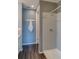 Clean bathroom with a tiled shower, white fixtures, and modern gray paint at 1868 Makley Loop, Castle Rock, CO 80104