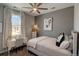 Cozy bedroom with a light color palette, desk and chair, complemented by art at 1868 Makley Loop, Castle Rock, CO 80104
