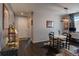Open-concept dining area featuring a unique light fixture, workspace and a cowhide rug at 1868 Makley Loop, Castle Rock, CO 80104
