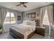 Bright main bedroom with large windows, soft lighting, and a cozy, neutral decor at 1868 Makley Loop, Castle Rock, CO 80104