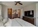 Well-appointed main bedroom with neutral tones, wood furniture, and an ensuite bathroom at 1868 Makley Loop, Castle Rock, CO 80104
