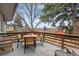 A relaxing outdoor living space on the back deck, complete with a dining table and a view at 6445 Balsam St, Arvada, CO 80004