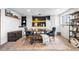 Inviting dining area with stylish table, ample seating, and natural light, adjacent to functional built-in cabinets at 6445 Balsam St, Arvada, CO 80004