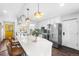 Stylish kitchen featuring an island with seating, stainless steel appliances, and a bright, airy feel at 6445 Balsam St, Arvada, CO 80004