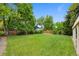 Beautiful backyard features lush green grass and trees at 8433 S Painted Sky St, Highlands Ranch, CO 80126