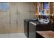 Unfinished basement laundry area features a washer and dryer at 8433 S Painted Sky St, Highlands Ranch, CO 80126