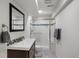 Modern bathroom features a glass shower, vanity, and neutral paint at 8433 S Painted Sky St, Highlands Ranch, CO 80126