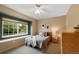 Relaxing bedroom features a window seat, natural light, and neutral paint at 8433 S Painted Sky St, Highlands Ranch, CO 80126