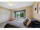 Bright bedroom features a window seat, closet, and neutral paint at 8433 S Painted Sky St, Highlands Ranch, CO 80126