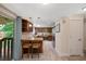Bright kitchen design with breakfast bar, stainless appliances, granite countertops, and an adjacent outdoor patio at 8433 S Painted Sky St, Highlands Ranch, CO 80126