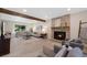 Inviting living room showcasing a cozy fireplace, wood beam and neutral decor for a comfortable atmosphere at 8433 S Painted Sky St, Highlands Ranch, CO 80126