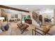 Warm living room featuring hardwood floors, open floor plan and a large window at 8433 S Painted Sky St, Highlands Ranch, CO 80126