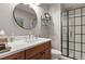 Modern bathroom with a frameless glass shower, new vanity, and updated fixtures at 2146 S Ellis Ct, Lakewood, CO 80228