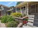 Close up on the front of the house, a quaint entrance featuring manicured garden and stairs at 2146 S Ellis Ct, Lakewood, CO 80228