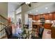Eat-in kitchen featuring wood cabinets, a center island, and clear sightlines to the front of the house at 2146 S Ellis Ct, Lakewood, CO 80228