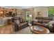 Cozy living room offering hardwood floors and views of the backyard at 2146 S Ellis Ct, Lakewood, CO 80228
