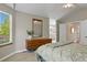 Main bedroom with ensuite bathroom, large closet, and natural light at 2146 S Ellis Ct, Lakewood, CO 80228