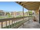 View from balcony overlooking the landscaped area of the complex and community pool at 8225 Fairmount Dr # 104, Denver, CO 80247
