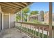 View from private balcony with white railing overlooking the community landscape and pool house at 8225 Fairmount Dr # 104, Denver, CO 80247
