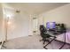 Bedroom with a modern desk setup and closet, ideal for work or gaming at 8225 Fairmount Dr # 104, Denver, CO 80247