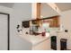 Bright, open kitchen featuring stainless steel appliances and a convenient breakfast bar at 8225 Fairmount Dr # 104, Denver, CO 80247