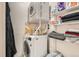 Efficient laundry room with stacked washer and dryer, maximizing space and convenience at 8225 Fairmount Dr # 104, Denver, CO 80247