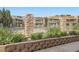 Community pool surrounded by fence and landscaping, providing a refreshing escape at 8225 Fairmount Dr # 104, Denver, CO 80247