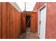 Backyard view of a wooden gate and detached structure with a door at 131 Fox St, Denver, CO 80223
