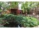 Backyard with pond and landscaping and a structure with a deck at 131 Fox St, Denver, CO 80223