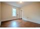 Bedroom with hardwood floors, natural light, and a closet doorway at 131 Fox St, Denver, CO 80223