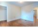 Bright bedroom with hardwood floors, white trim, neutral walls, and a view to adjacent rooms at 131 Fox St, Denver, CO 80223