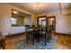 Open-concept dining area with a stylish table and chairs, seamlessly connecting to the kitchen and living spaces at 131 Fox St, Denver, CO 80223