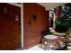 Cozy front porch seating area with ornate iron furniture, perfect for enjoying a quiet moment at 131 Fox St, Denver, CO 80223
