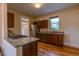 Traditional kitchen with wood floors, granite counters, stainless appliances and wooden cabinets at 131 Fox St, Denver, CO 80223