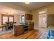 Traditional kitchen with wood floors, granite counters, stainless appliances and wooden cabinets at 131 Fox St, Denver, CO 80223
