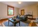 Cozy living room with hardwood floors, a comfortable sofa, and a large window for natural light at 131 Fox St, Denver, CO 80223