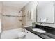 Updated bathroom featuring a modern vanity and a shower-tub combo at 3470 S Poplar St # 404, Denver, CO 80224