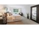 Inviting bedroom with plush carpet, ample natural light, and a soothing color palette at 3470 S Poplar St # 404, Denver, CO 80224