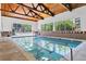 Indoor pool featuring a wood ceiling and plenty of natural light at 3470 S Poplar St # 404, Denver, CO 80224