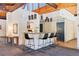 Stylish lounge area with modern pendant lighting, a bar, seating, and contemporary decor at 3470 S Poplar St # 404, Denver, CO 80224