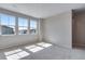 Spacious bedroom with carpet flooring, neutral walls, recessed lights, and three windows offering neighborhood views at 9973 Worchester St, Commerce City, CO 80022