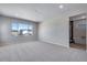 Expansive bedroom with plush carpet and large windows providing great natural light at 9973 Worchester St, Commerce City, CO 80022