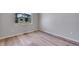Cozy bedroom featuring vinyl floors and a large window at 9973 Worchester St, Commerce City, CO 80022