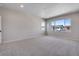 Spacious bedroom featuring neutral carpet, recessed lights, and bright windows at 9973 Worchester St, Commerce City, CO 80022